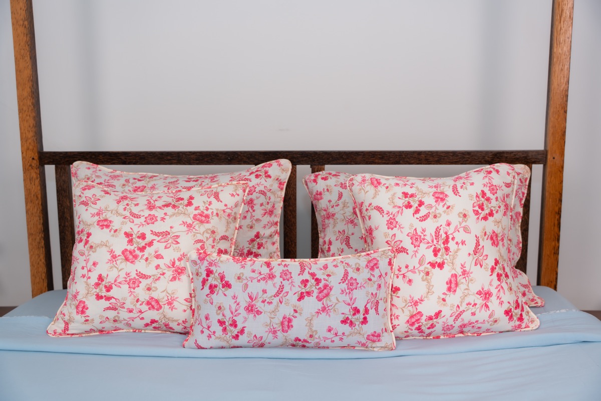 Pink floral bed pillows close-up