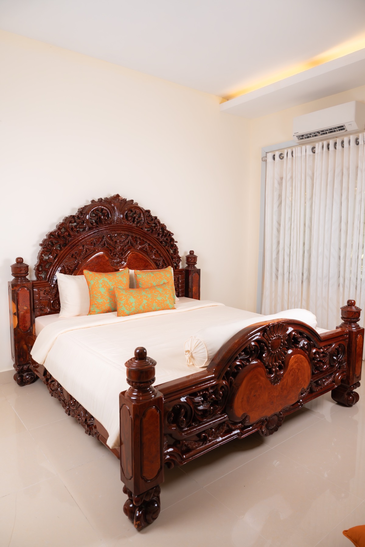 Gold green pillows on carved bed