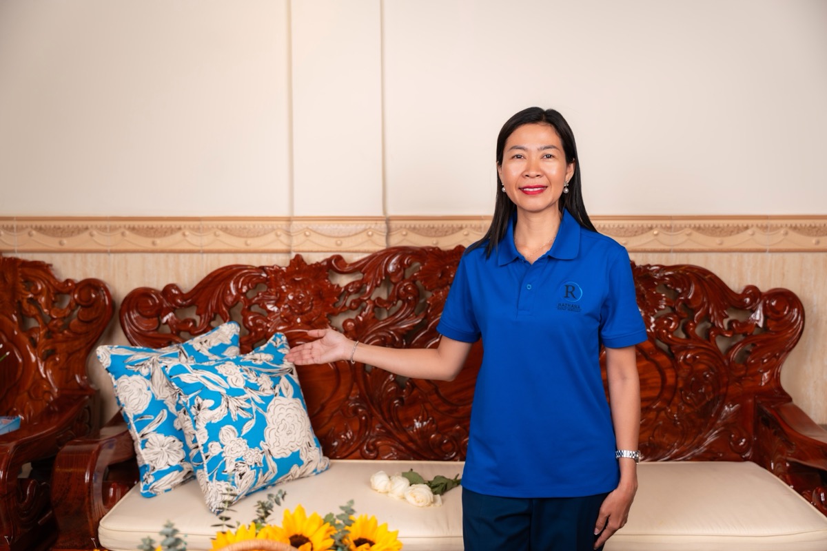 Artisan presenting blue floral cushions